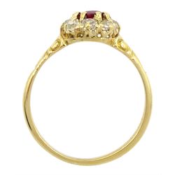 Early 20th century 18ct gold oval cut ruby and old cut diamond cluster ring, stamped, ruby approx 0.45 carat, total diamond weight approx 0.35 carat