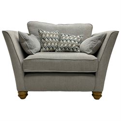 Oak Furnitureland - 'Gainsborough' lounge suite - three seat sofa, out-swept arms with loose cushions on turned oak feet, upholstered in 'Minerva Silver' fabric (W209cm D102cm H80cm); matching armchair or snuggler settee (W125cm); and rectangular ottoman footstool