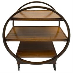 1930s Art Deco period walnut Moon drinks trolley, three tiers encased by two circular supports, raised on castors