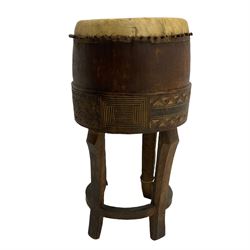 Early 20th century hardwood tribal drum, with incised decoration (H70cm), and a spinning chair