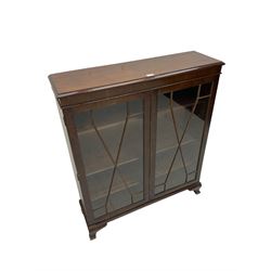 Early 20th century mahogany glazed display cabinet, enclosed by two astragal glazed doors, on ogee bracket feet