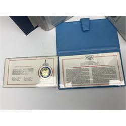 Thirty-one 'International Society of Postmasters Official Commemorative Issues' sterling silver proof medallic covers dating from 1975 to1977, housed in the official folder and a 'Commemorating The Bicentennial Of The United States Of America' sterling silver proof medallic first day cover in blue wallet