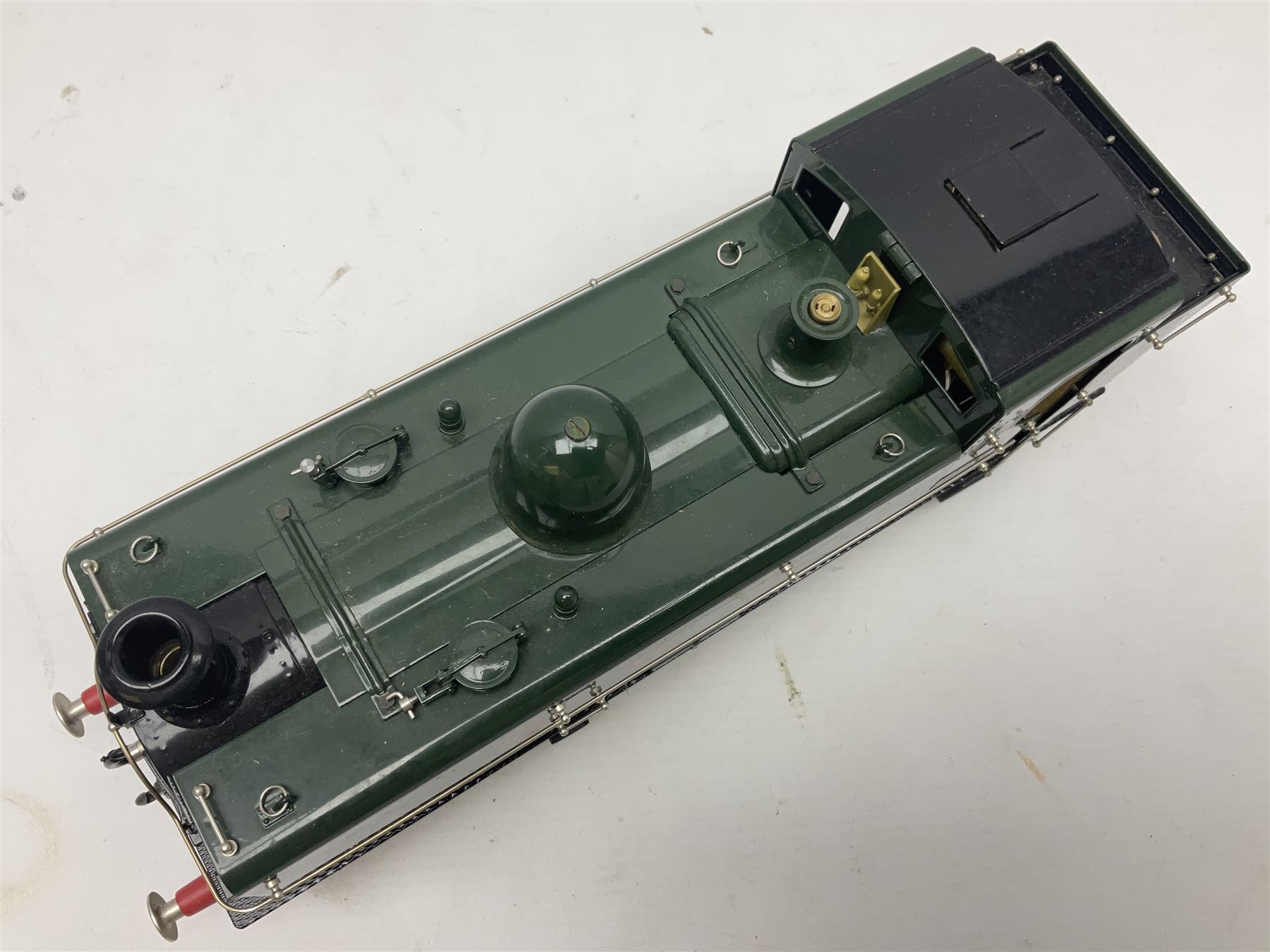 Gauge 1 - Aster 0-6-0 Great Western Railway Pannier tank locomotive No.6752; spirit fired and live steam powered with fitted steam pressure gauge, water sight glass and other usual fittings; finished in Great Western Railway green livery with GWR initials to the pannier tanks, fitted steps, handrails, checker plate, lamp irons, buffers and vacuum hoses; L31cm W8.5cm