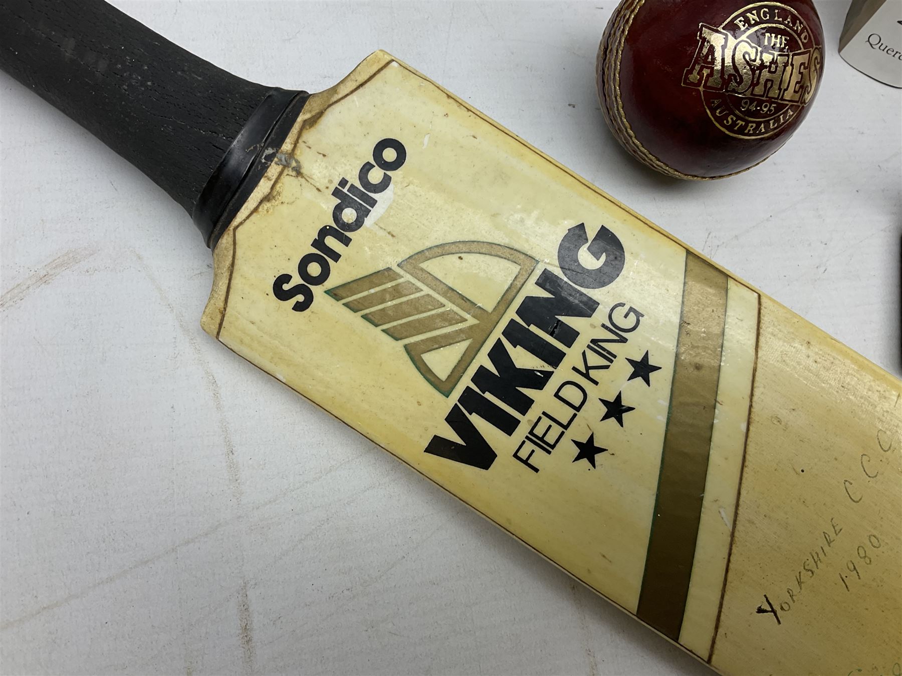 Sondico cricket bat with Yorkshire C.C.C. signatures; framed Lord Taverners v Barclaycard XI programme signed by Colin Milburn, Colin Cowdrey, Roy Kinnear, Nicholas Parsons etc; souvenir Ashes 1994/95 cricket ball; books of cricket interest; tie-pin etc