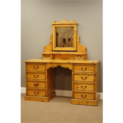  Pine kneehole dressing table with eight drawers and mirror, W137cm, H155cm, D47cm   