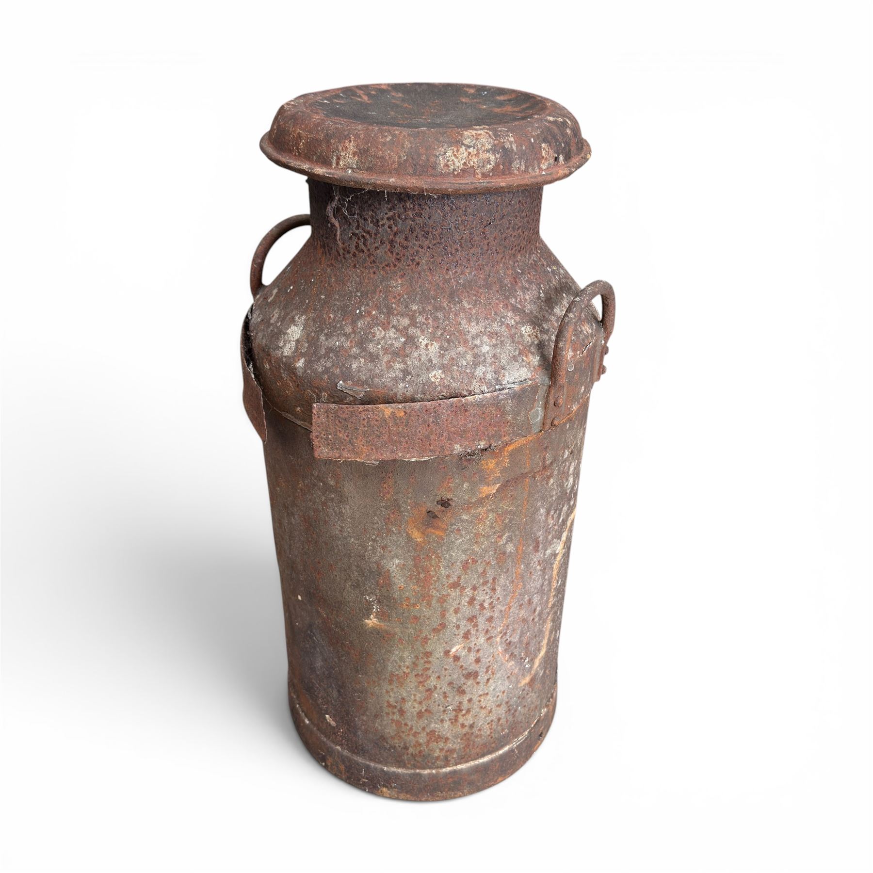 19th century milk churn with weathered patina along with aluminium watering can