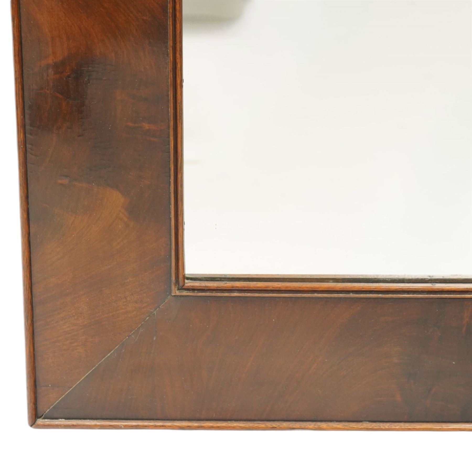 19th century mahogany framed wall mirror, rectangular plate within a wide banded figured mahogany frame