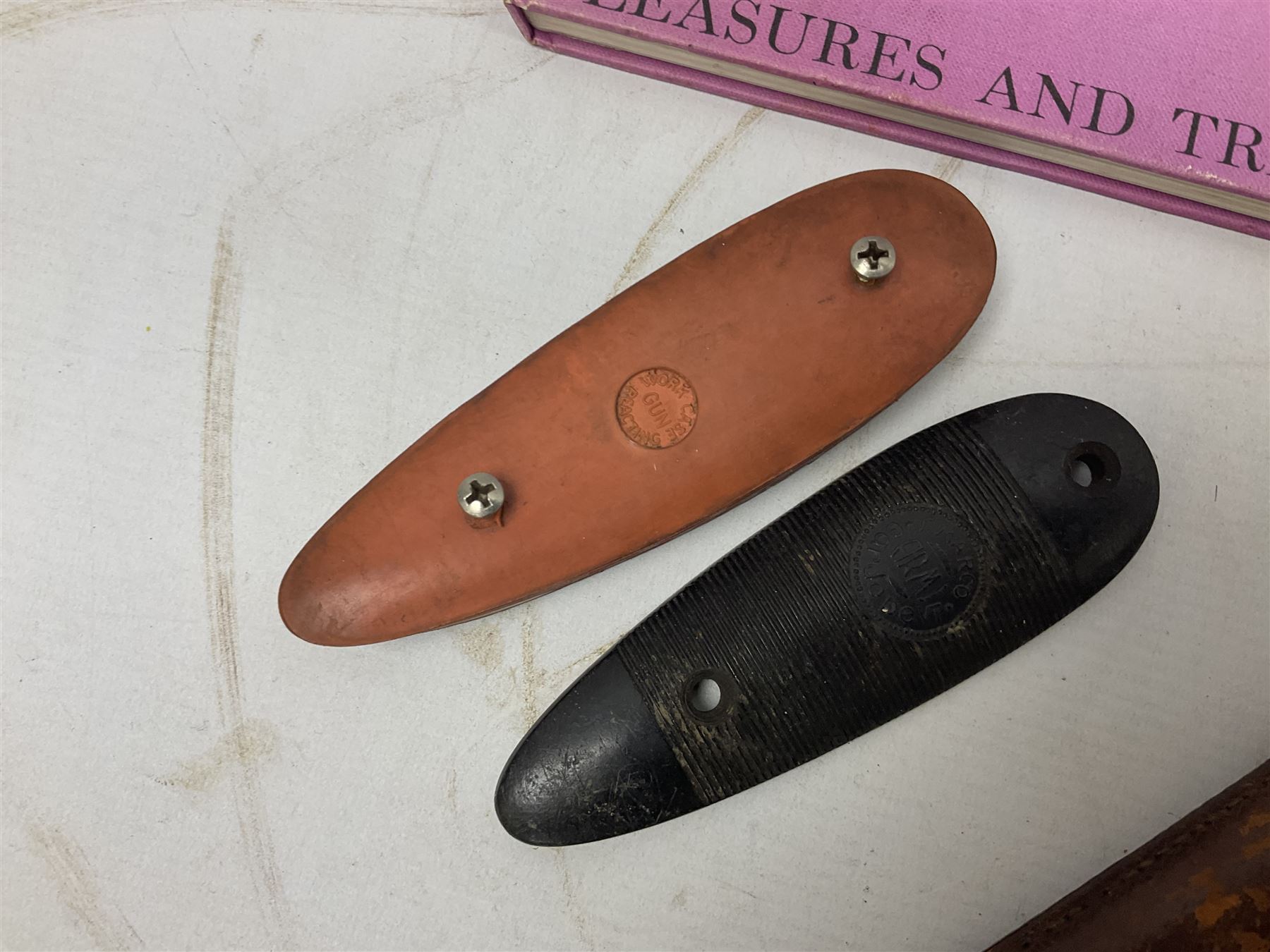 George V 1897 pattern Infantry officers sword, the 82cm single fullered blade with traces of etched detail and George V crown cipher, the ricasso marked Hawksworth Sheffield, pierced half basket hilt with George V cypher, wire-bound fish-skin grip with brass pommel and backstrap; in leather scabbard L102cm overall; together with two sectional gun cleaning rods; swagger stick made of leather strips etc