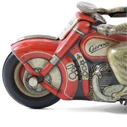 Schuco Curvo 1000 tinplate clockwork motorcycle, in red and cream, with rider in green jacket