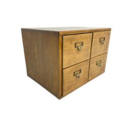 Mid-20th century oak desktop filing cabinet, fitted with four drawers with brass handles and index card holders