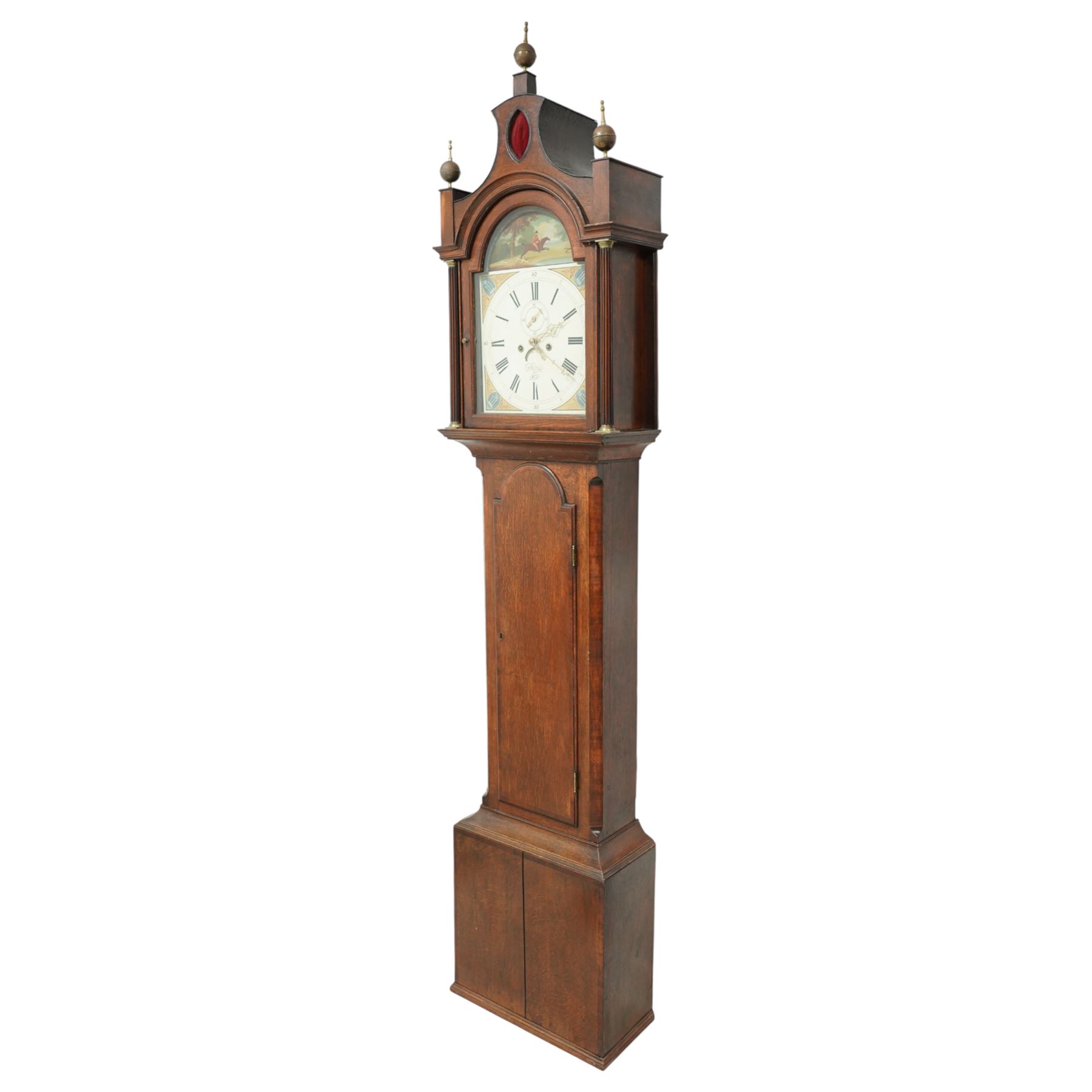 Patrick Forrester of Hull-early 19th century 8-day oak and mahogany longcase, c1830, With a pagoda pediment and three matching ball and spire finials, break arch hood door beneath flanked by reeded pilasters with brass capitals, trunk with canted corners and a full length break arch topped door with crossbanding, on a square plinth with an applied moulding to the base, fully painted dial with matching spandrels and a scene of a huntsman to the arch, with Roman numerals, fifteen minute Arabic's, stamped brass hands, seconds dial and date aperture, dial pinned via a falseplate to a rack striking movement, striking the hours on a bell. With key, weights and pendulum.   A good example of this refined design of case popular in the East Riding of Yorkshire and London, the hood is of particularly good proportions.
Patrick Forrester is listed as working in Hull 1813-1840, also as a Jeweller and Goldsmith.         