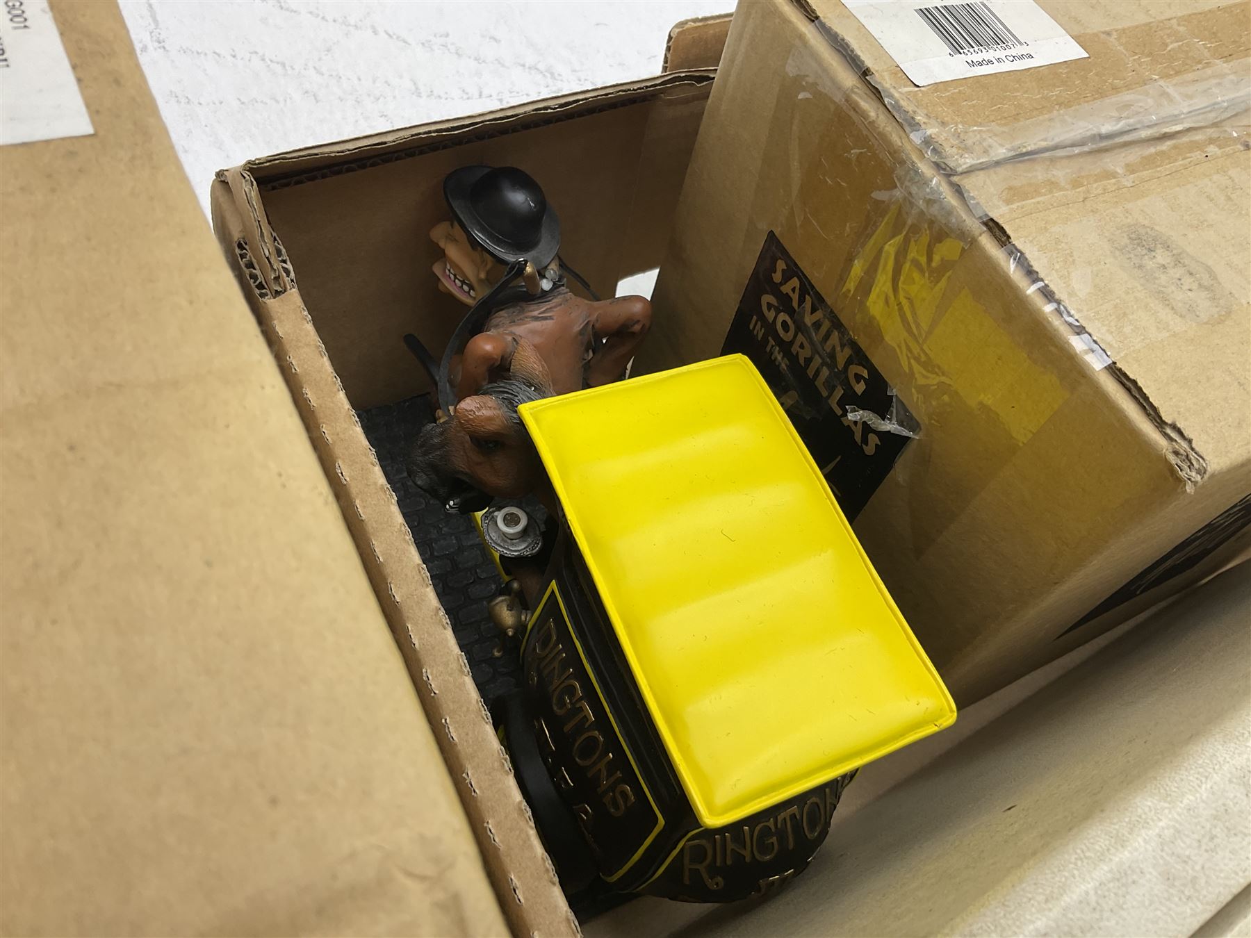 Quantity of boxed Saving the Gorillas in the Mist figures, boxed Royal Doulton glasses, art glass, ceramics etc in four boxes