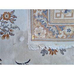 Large Persian design beige ground rug