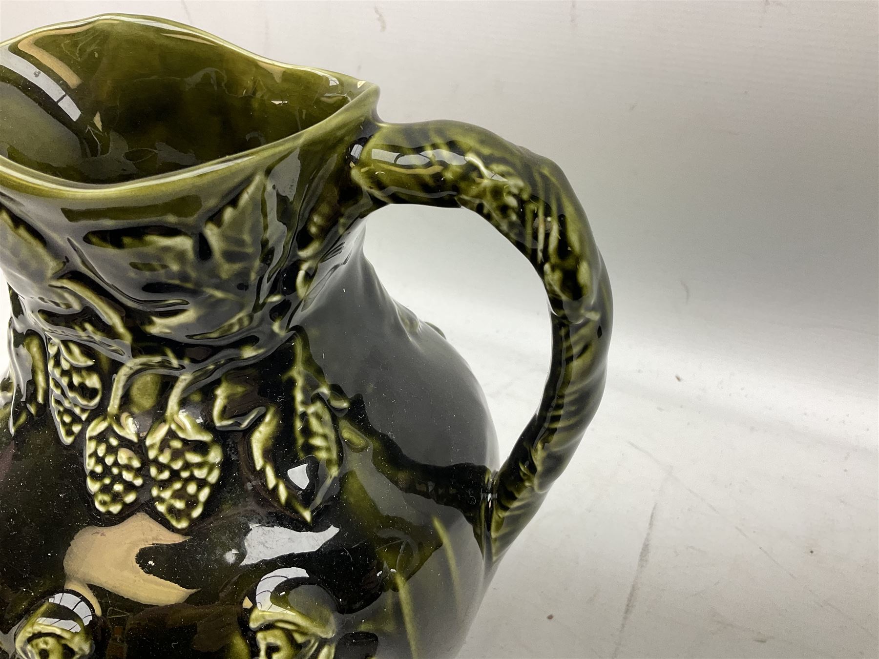 Three jardinières comprising West German Gerz example decorated in relief, Doulton Slaters example with frilled everted rim and a majolica example, and a further two Arthur Wood majolica jugs (5)