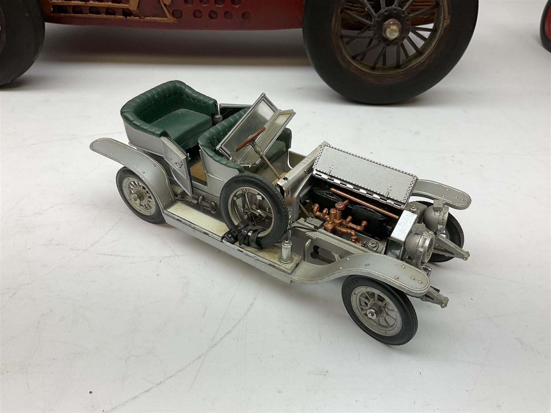 Four Franklin Mint Precision Models, one with hardwood body; large reproduction model of a vintage racing car L52cm; and four other modern metal/wooden models of vintage cars; all unboxed (9)