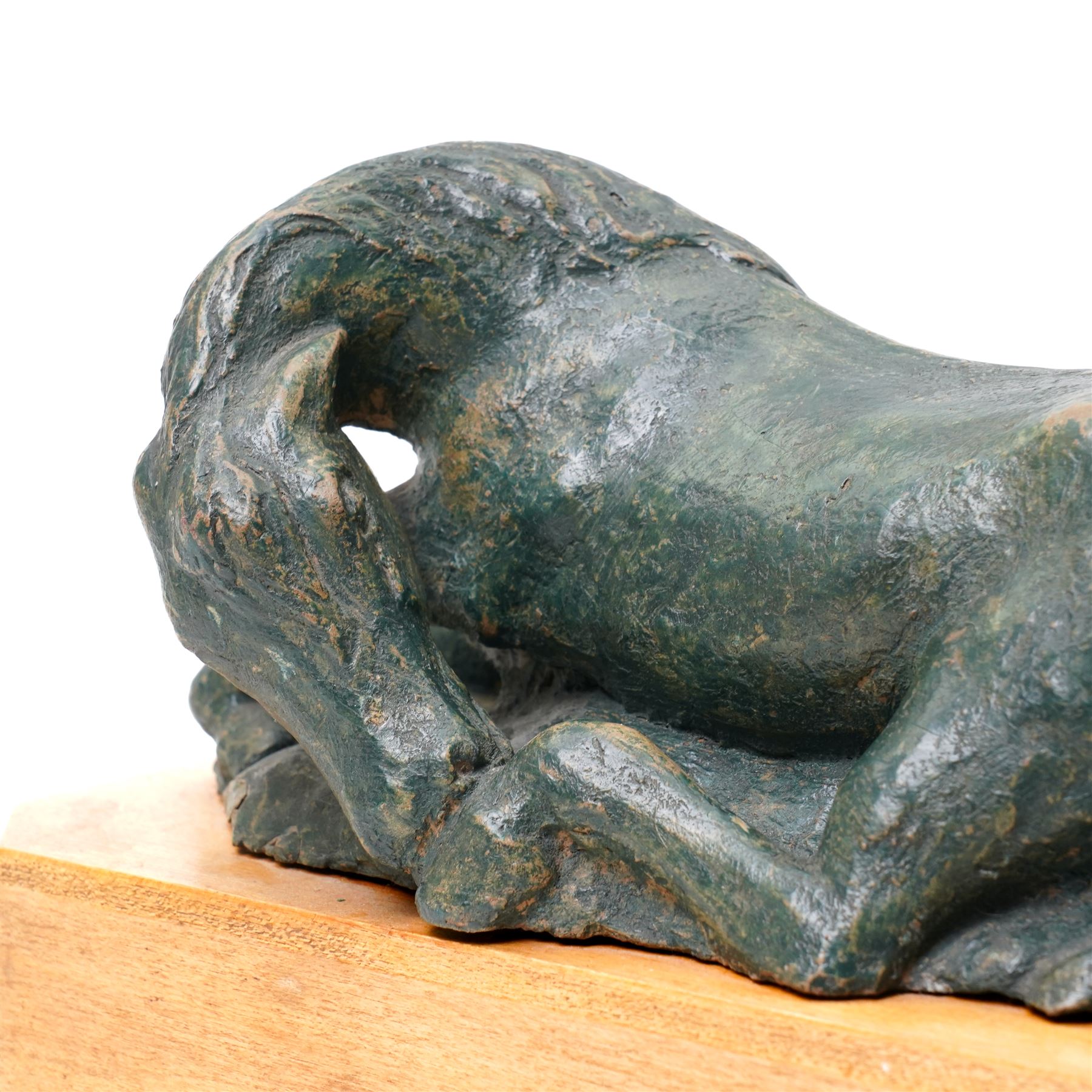 Mid-20th century painted terracotta figure of a recumbent horse, including wooden plinth W31cm