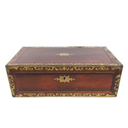 Rosewood writing slope, with brass inlaid decoration, the lid opening to reveal a purple w...