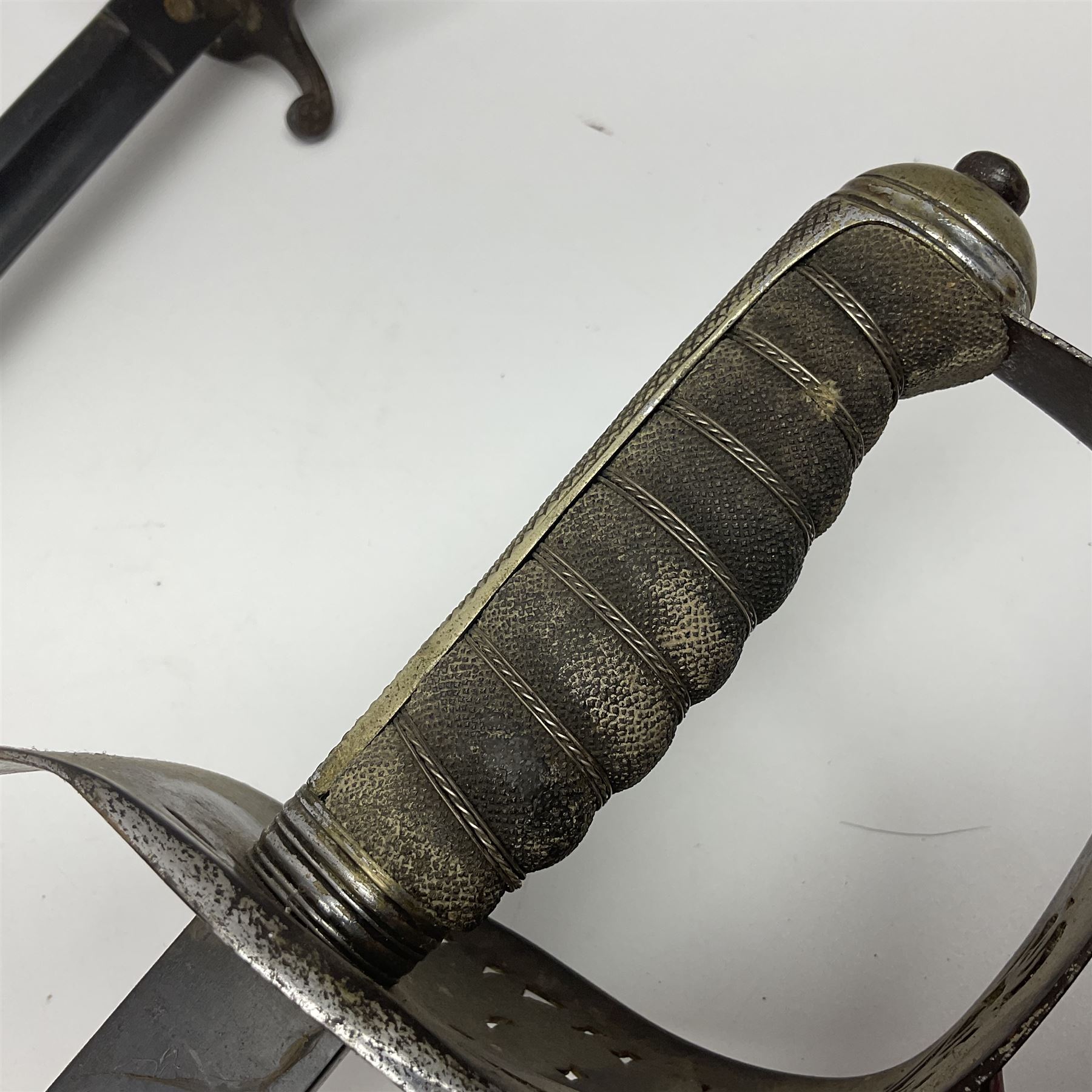 WW1 British Army 1897 Pattern Officers Sword, the 80cm fullered steel blade with traces of decoration and inscribed 'W.E. French 1914'; the basket hilt pierced with the George V cypher and wire-bound fish-skin grip L97cm overall; and WW1 British 1821 pattern Royal Artillery officer's sword with three-bar hilt; both lacking scabbard (2)