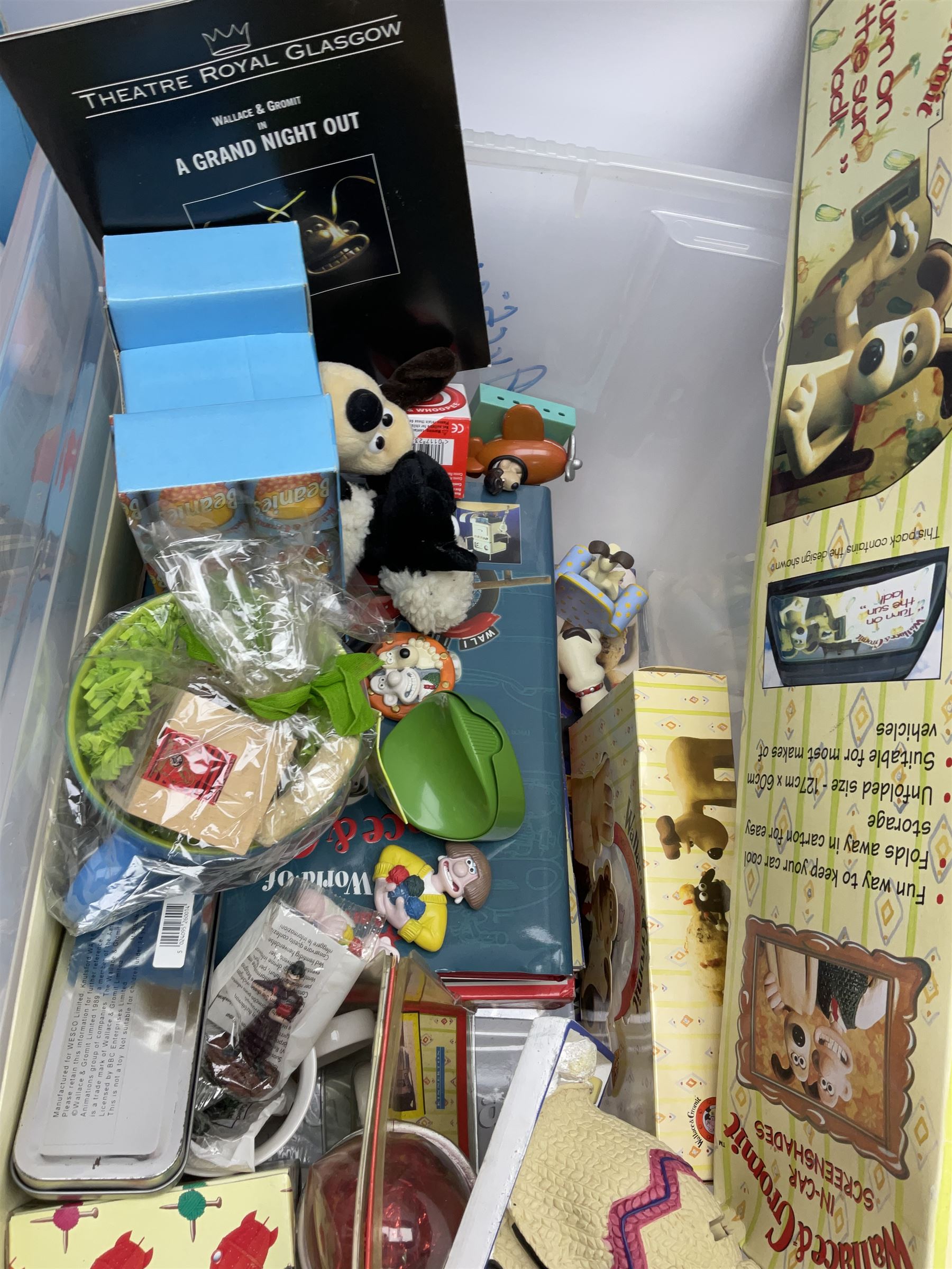 Quantity of Wallace and Gromit toys, accessories and memorabilia including soft toys, figurines, electronic ‘Talking Wallace’, car screen shades, and a quantity of Chicken Run Related merchandise, in three boxes
