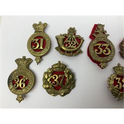 Fifteen regimental cap badges, nos.22, two x 24 & 28 - 39, including Cheshire, Warwickshire, Cambridgeshire, Huntingdonshire, Cornwall L.I., Cumberland, Sussex, Dorsetshire etc (15)