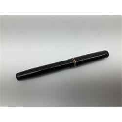 Vintage Swan Mabie Todd lever fill fountain pen in coral red, the nib a/f marked 14K, together with two further vintage Swan Mabie Todd fountain pens, the first example with lever fill, the other leverless, each with black body, one with nib marked 14ct, (3) 