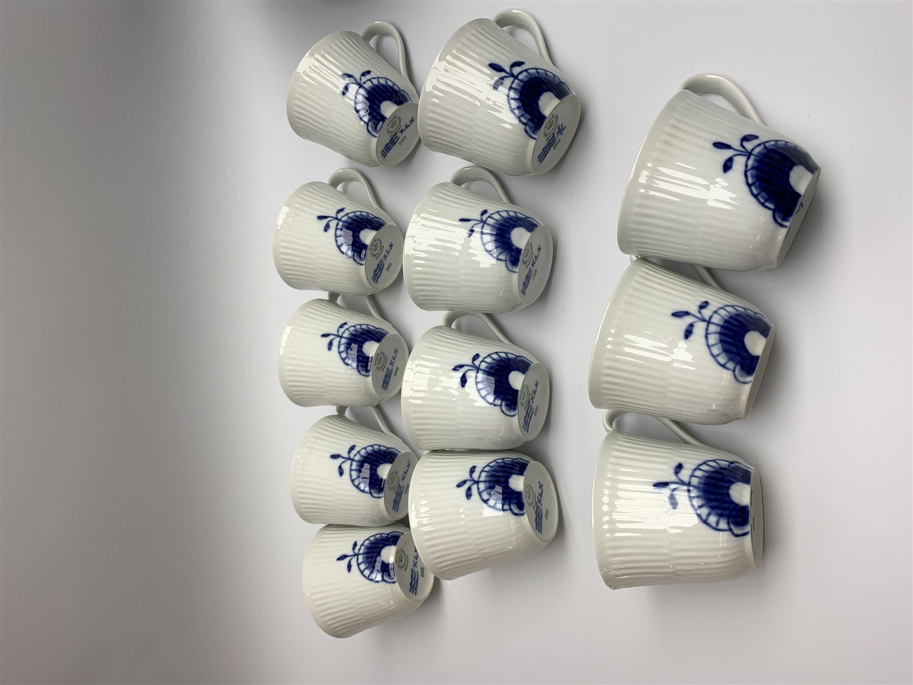 Royal Copenhagen tea and dinner service for twelve place settings, decorated in the Mega Blue Fluted pattern, pattern number 622, comprising dinner plates, salad plates, bowls with pierced rim, smaller bowls, tea cups, and saucers, dinner plates D27.5cm, salad plates D22cm