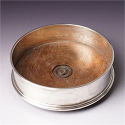 German 925 standard silver cigarette box with hinged lid  and a silver bottle coaster with turned wood base London 1986 Maker M C Hersey & Son