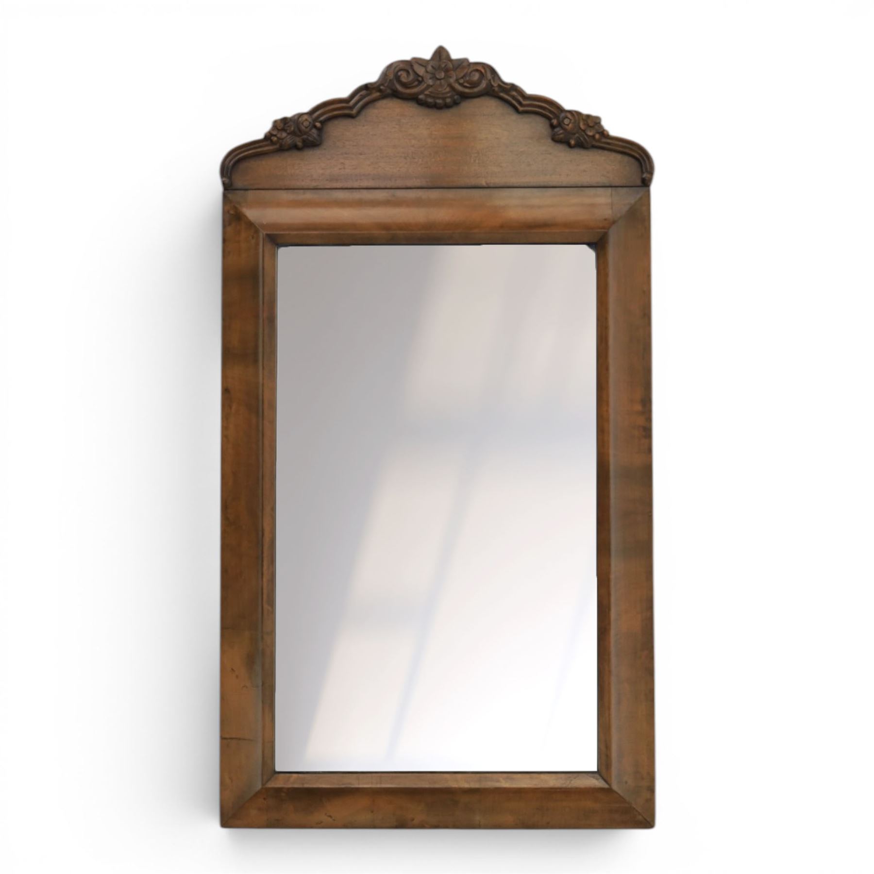 Late 19th century walnut dressing mirror, rectangular mirror plate within a moulded frame, shaped carved crest with floral and foliate detail