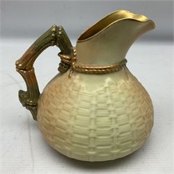 Royal Worcester blush ivory basket weave ewer, the vase of bag shape with twisted rope to the neck decorated with applied decoration of orange and green gilt-heightened lizard and naturalistic sectioned bamboo handle, with stamped puce marks and no 1714 beneath, H15cm