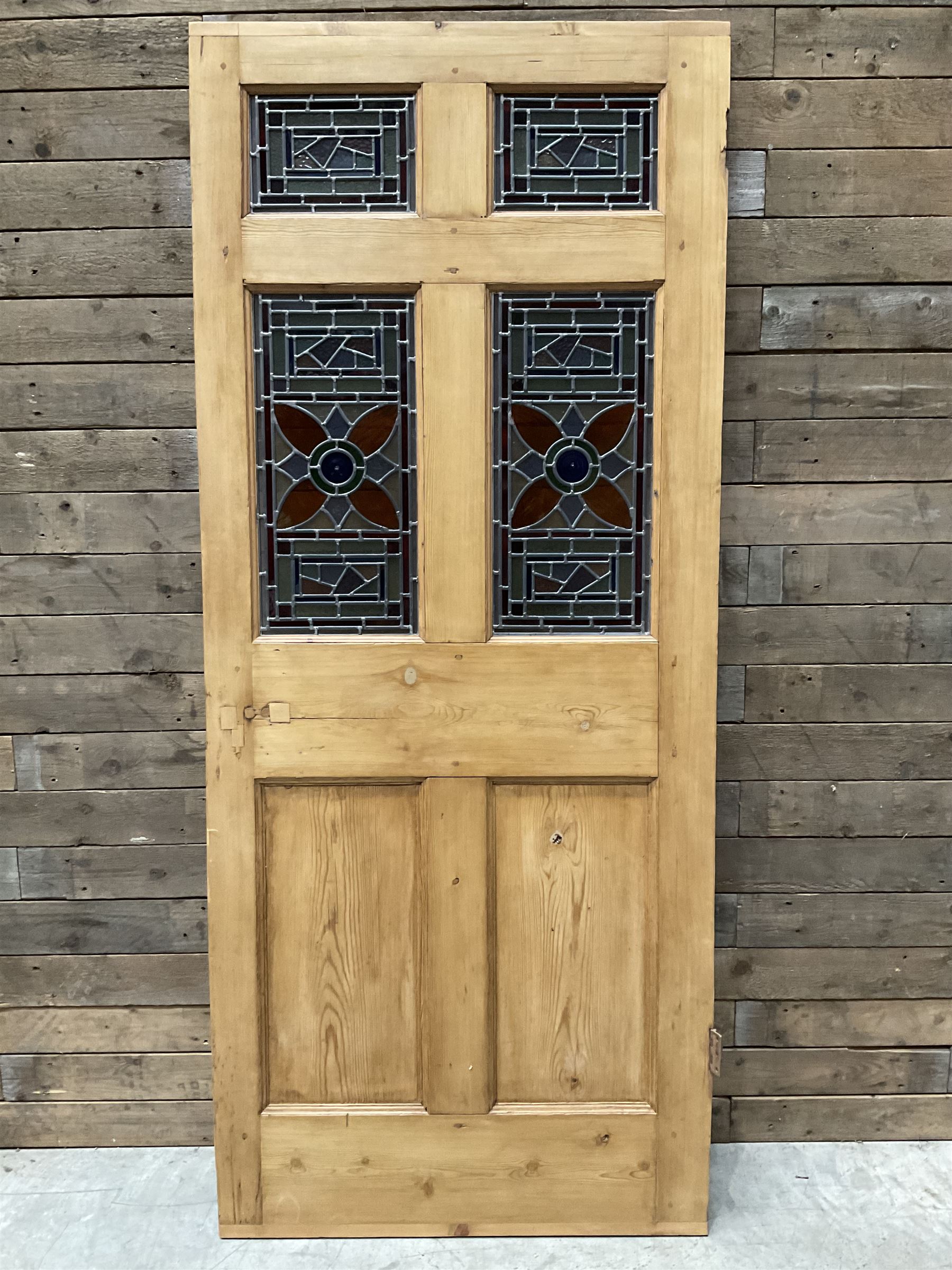Early 20th century pine six panel door with later stained glass panels
