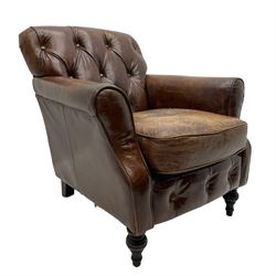 Georgian design club armchair, upholstered in buttoned brown leather, on turned front feet