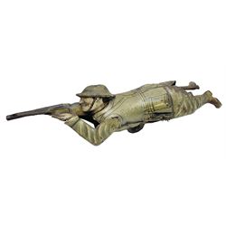 Einfalt (Germany) lithographed tin-plate clockwork figure of a soldier depicted lying on the ground firing a rifle L19cm.