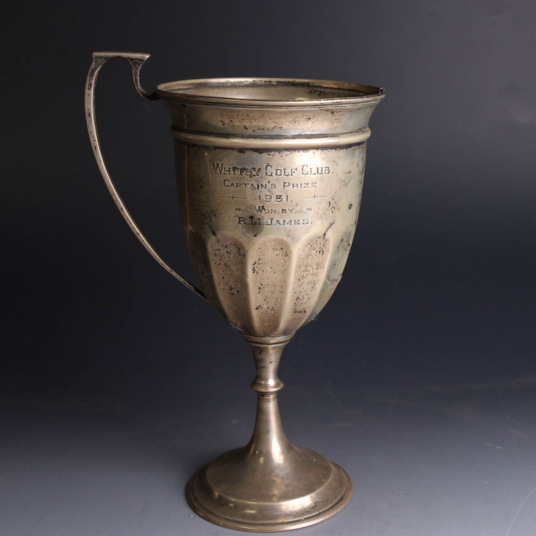 1930s silver trophy cup, of typical part fluted form with presentation engraving to body, with twin handles, one broken loose, hallmarked 	Charles Boyton & Son Ltd, London 1931, H21cm