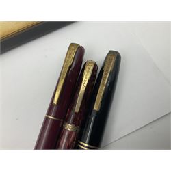 Group of Waterman pens and propelling pencils, to include a fountain pen, the black barrel with rolled gold cap and nib stamped 14ct, together with a matching propelling pencil, in box, together with a further fountain pen with gold nib stamped 14ct, stainless steel fountain pen and rollerball set in box, propelling pencil with maroon barrel etc, largest L13cm (7)