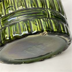 Jardiniere and stand, the jardiniere modelled as a pale, the stand with foliate and foliage decoration on a green ground, stand H73cm 