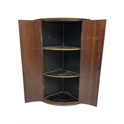 George III oak bow front corner cabinet fitted with two shelves