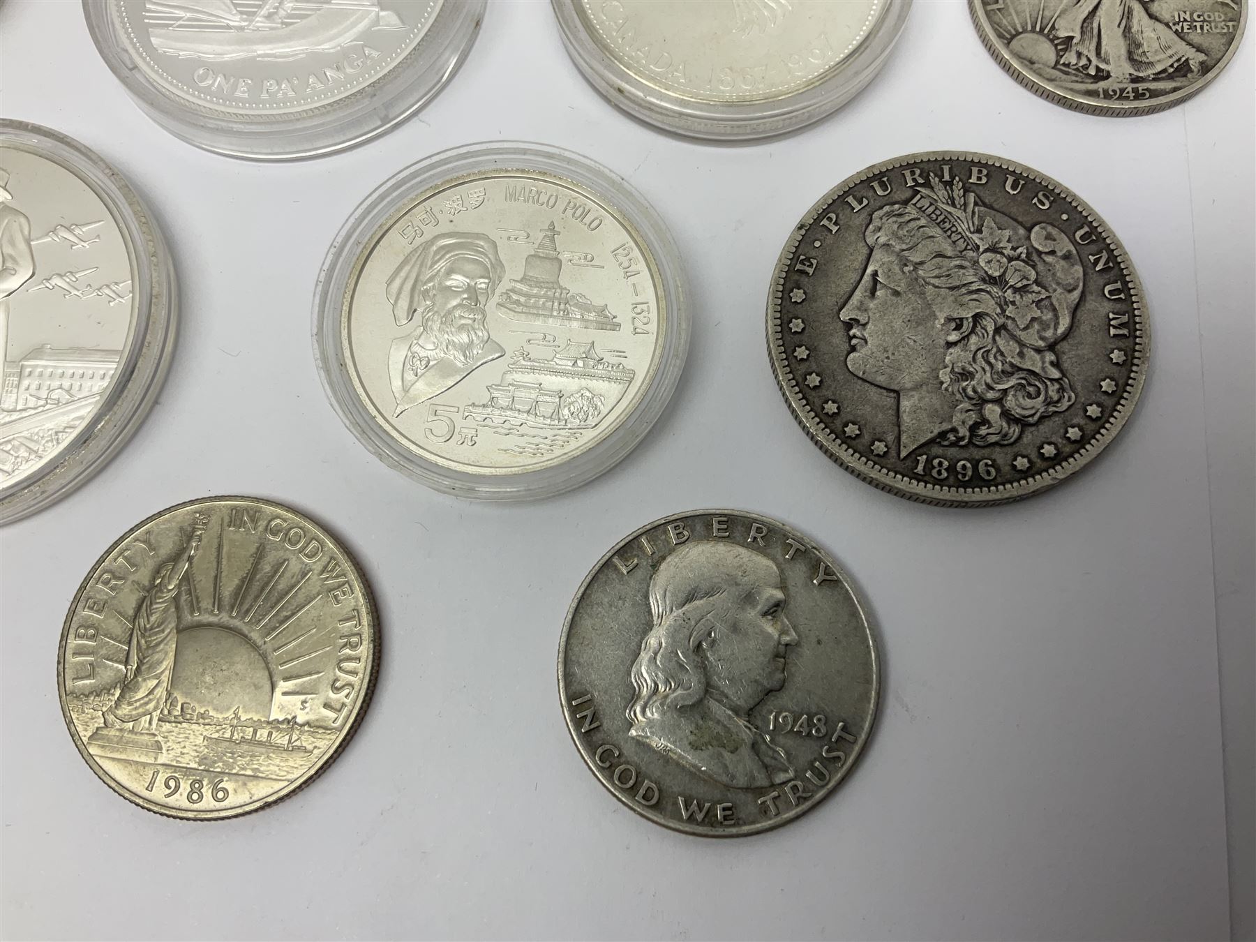 United States of America 1896 Morgan one dollar coin, 1893 'Columbian Exposition' commemorative half dollar, 1945 standing Liberty half dollar, Queen Elizabeth II Australia 1993 one ounce fine silver dollar, Canada 1967 and 1995 one dollar coins etc (15)