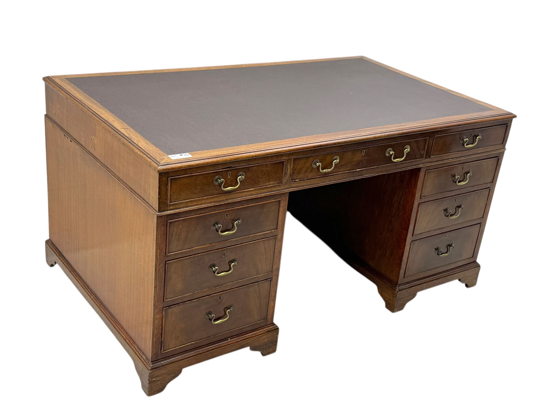 Edwardian mahogany twin pedestal desk, rectangular burgundy leather top moulded edge, over three short drawers with brass swan neck handles, over twin pedestals with graduating drawers supported on bracket feet