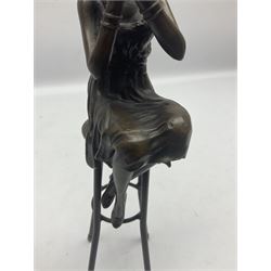 Art Deco style bronze figure of a lady seated on a stool applying lipstick, after Dimetri H Chiparus, with foundry mark, H28cm