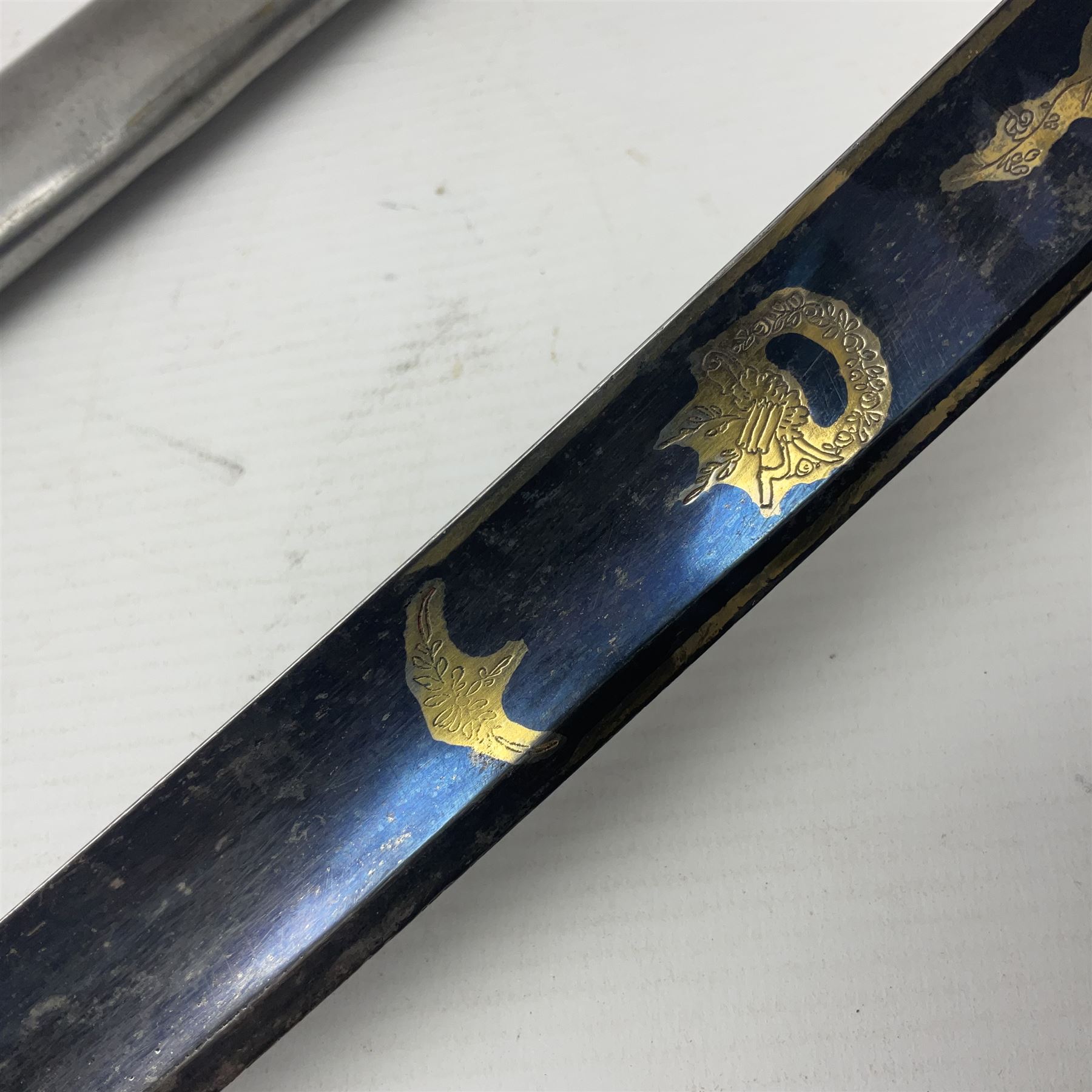 Early 19th century French Lancers officer's sword c1810, the 84cm curving fullered blade retaining most of its bluing, gilding and engraved decoration, inscribed I.S.& C. to ricasso (for Schimelbusch), brass three-bar hilt with elongated elliptical langets and wire-bound leather grip; in polished steel scabbard with two brass suspension rings L100cm overall