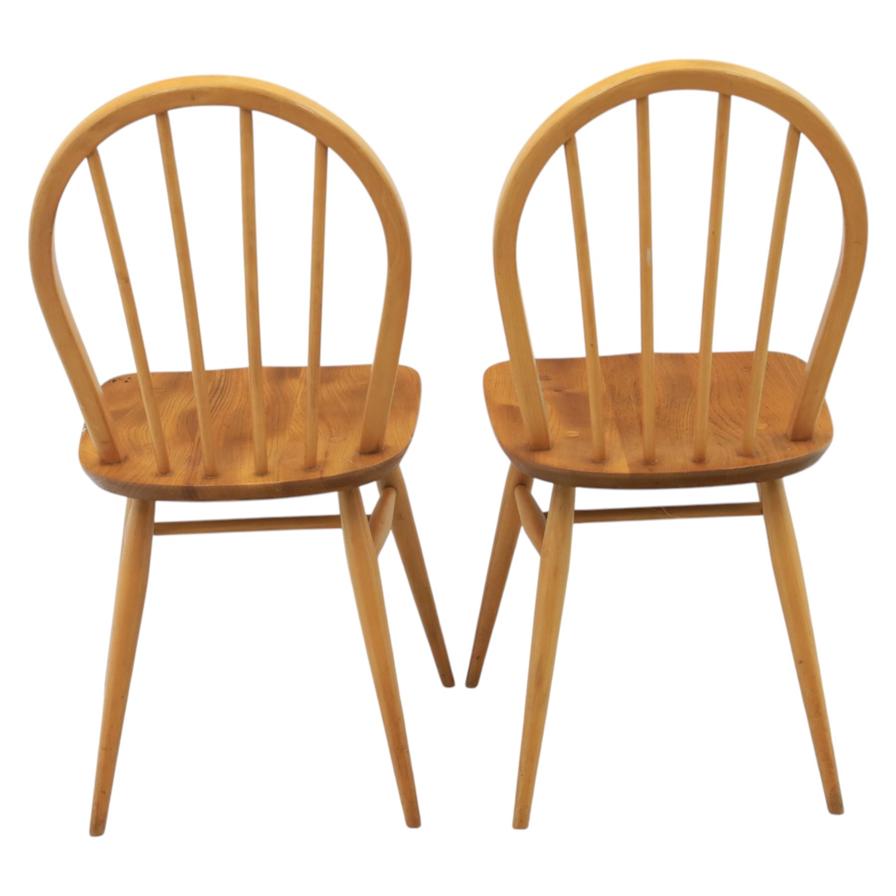 Ercol - set of four 'Windsor' waxed elm chairs, with hoop back design, on tapering supports