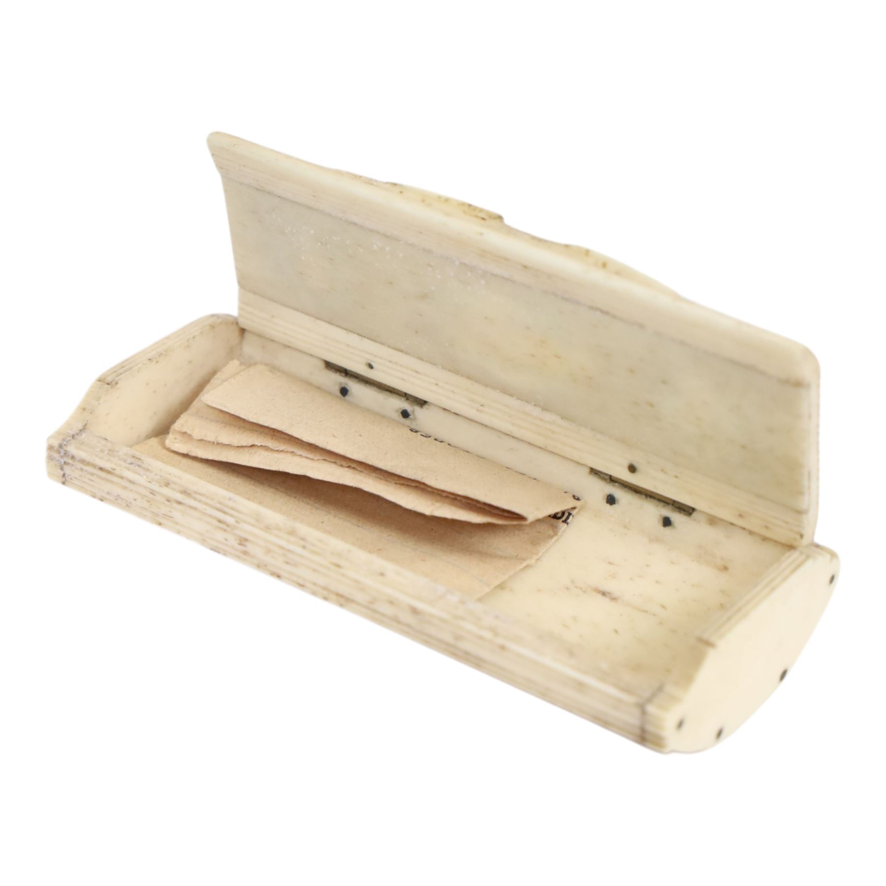 French Napoleonic Wars prisoner of war bone snuff box 1805-20, with coloured insets in the hinged lid depicting a man and woman facing each other with a central image of two hearts pierced with an arrow, H2cm, L9cm 