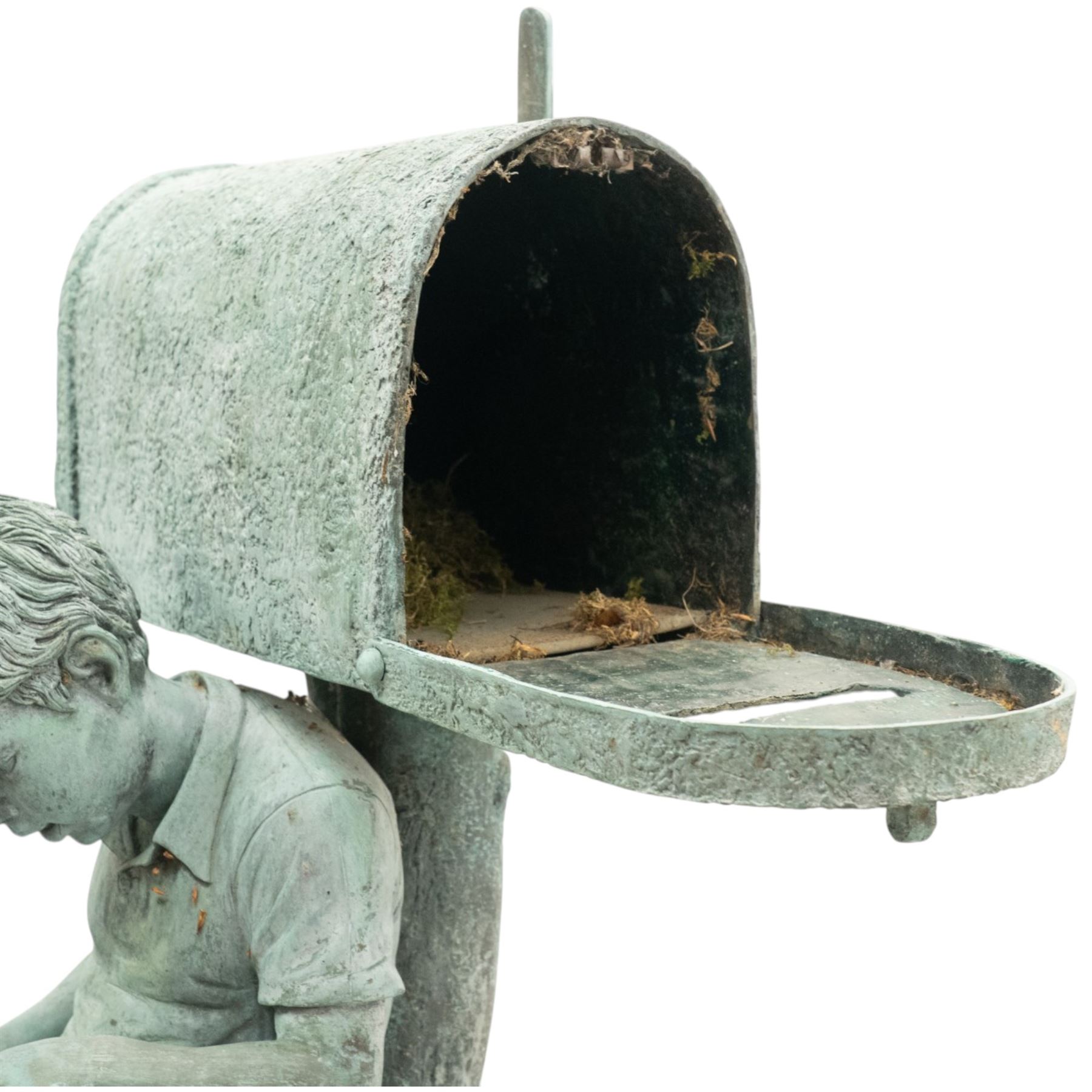 After Eneri Prosperi, bronze garden letterbox, modelled as a seated boy reading on a tree stump, with rustic post box with mail indicator, dog at his feet, textured verdigris finish throughout