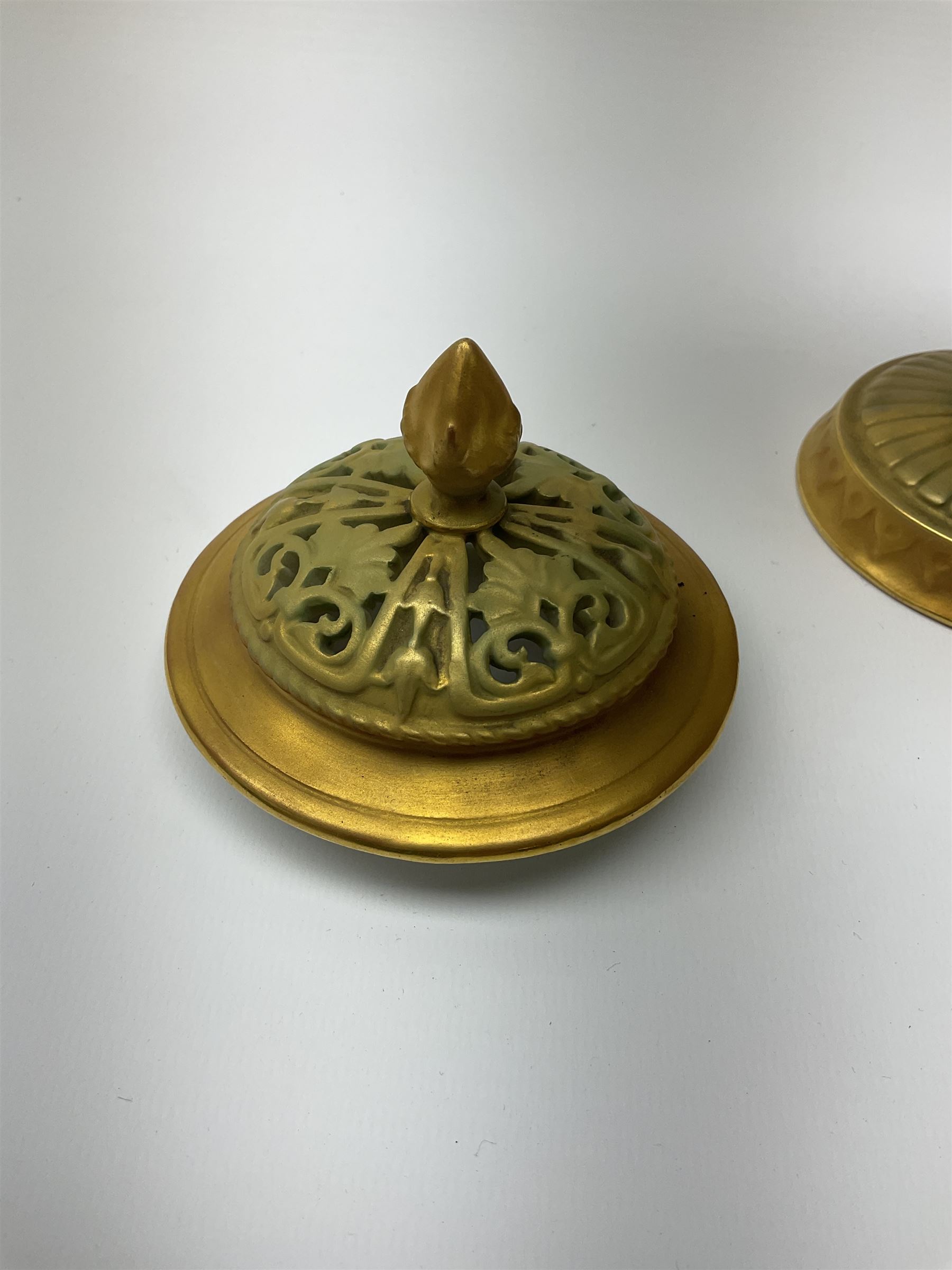 A Royal Worcester potpourri vase and cover, shape 1813, the bulbous body hand painted with pink roses and signed A Watkins, supporting a gilded and burnished pierced cover, upon a moulded stem with zoomorphic mask detail and circular foot, with puce printed mark beneath, H24cm