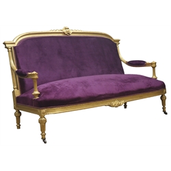  20th century gilt wood framed French style settee, moulded cresting rail carved with cartouche, upholstered in purple fabric, sprung seat, W160cm  