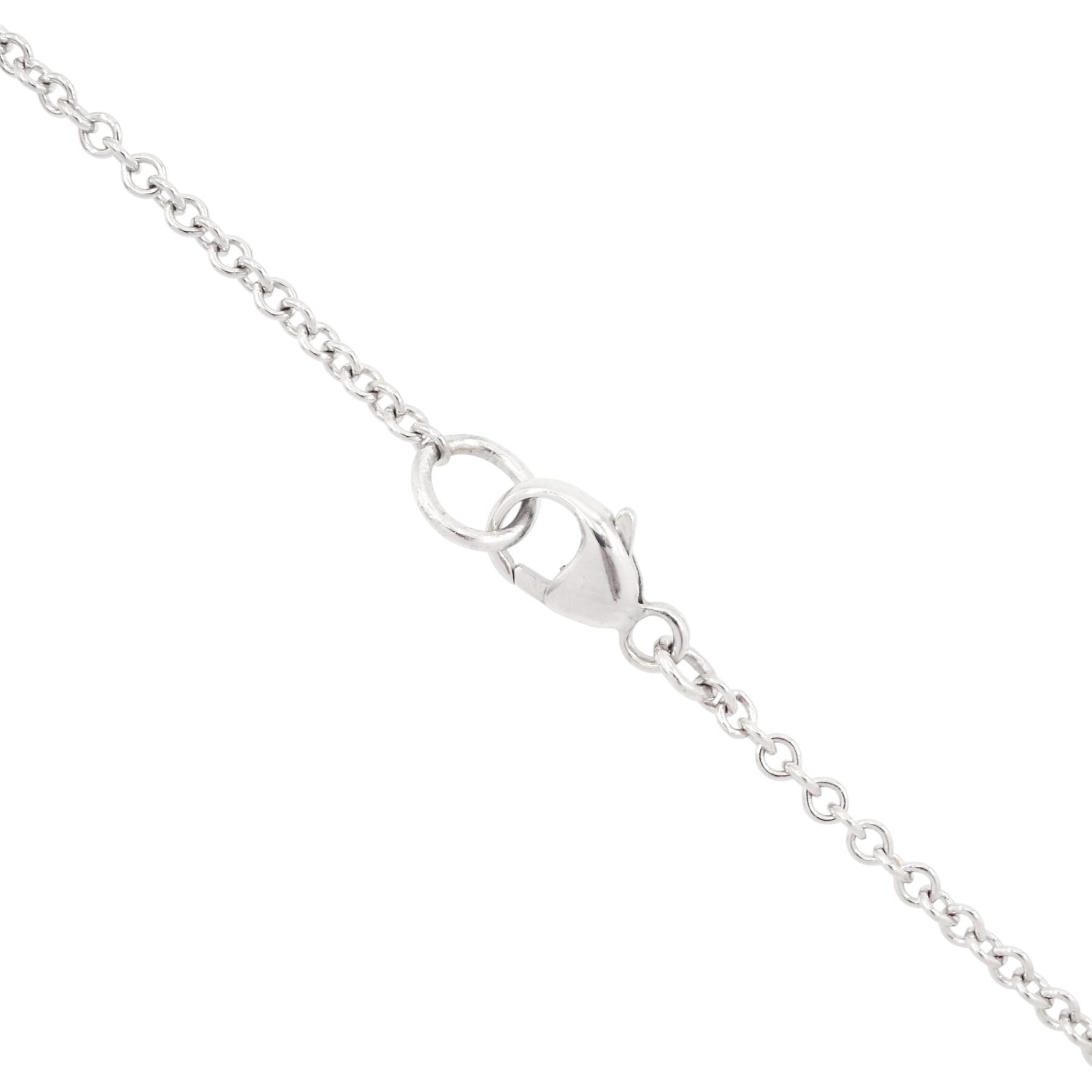 Platinum ruby diamond cluster pendant necklace, single oval cut ruby in a four claw 18ct rose gold setting of approx 0.58 carat, surrounded by two rows of round brilliant cut diamonds, London 2018, total diamond weight approx 0.84 carat, with Alan Poultney Gems report