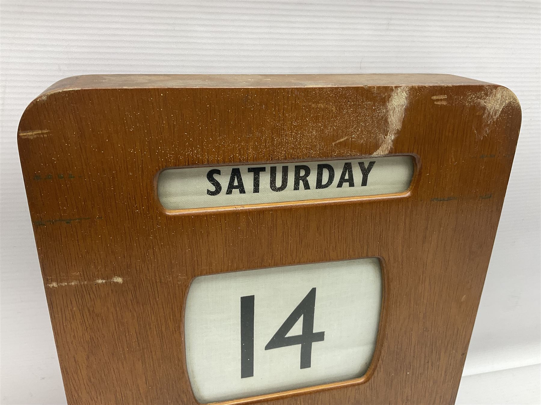 Wooden wall mounted perpetual calendar with printed rollers and chrome plated knobs to side, H30cm W27cm