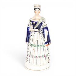 Group of 19th century Staffordshire figures, comprising pair depicting Queen Victorian and Prince Albert, she stood crowned, wearing short cloak, her hand clasped in front of her waist, he wearing cloak and military jacket, tallest example H28cm, figure group depicting The Prince and Princess Alexandra of Denmark, later Princess of Wales, he wearing green jacket and holding top hat in his left hand, she wearing bodice and full length skirt and carrying hat over he right arm, H24.5cm, and figure group depicting Empress Eugenie and Napoleon III, he in uniform, his left hand upon a plinth, she seated in chair, H23.5cm