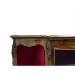 19th century rosewood buffet credenza, bombe form with shaped and moulded top, two central glazed doors with foliate moulded gilt slips, the red fabric-lined interior fitted with a single shelf, flanked by open shelves with raised gilt metal lips, the uprights decorated with shell and flower head carved cartouche mounts, acanthus leaf scroll carved lower mounts, on shaped and moulded plinth base 