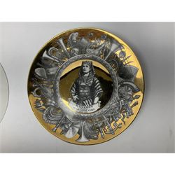 Three Fornasetti plates from the Melodramma series, each depicting a operatic portraits within a border of operatic emblems on gilt ground, with printed mark beneath, D25cm 